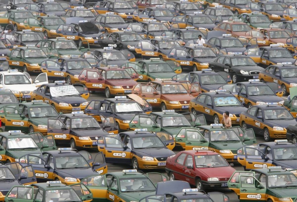 taxi-drivers-line-up-in-a-parking-lot-while-waiting-for-passengers-at-the-new-beijing-capital-international-airport (1)