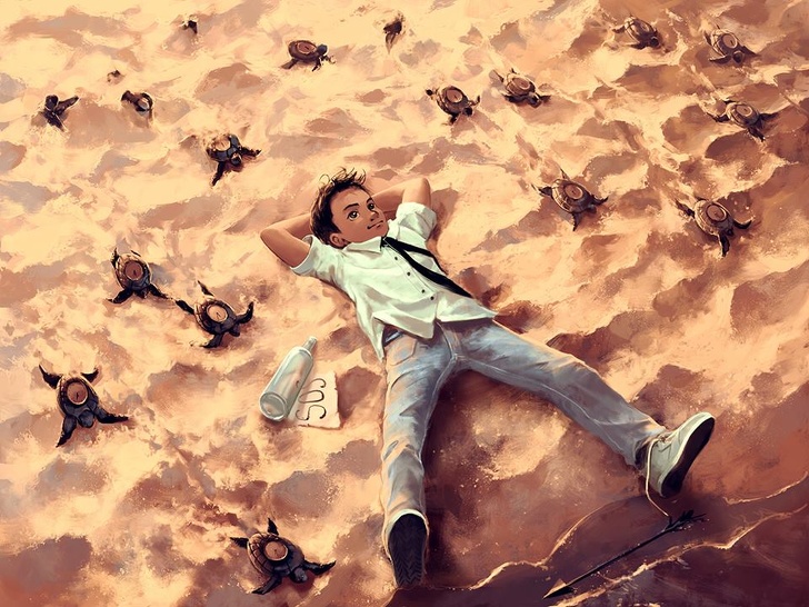 Мальчик лежит на песке